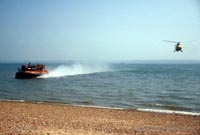 Approaching shore, with helicopter escort
